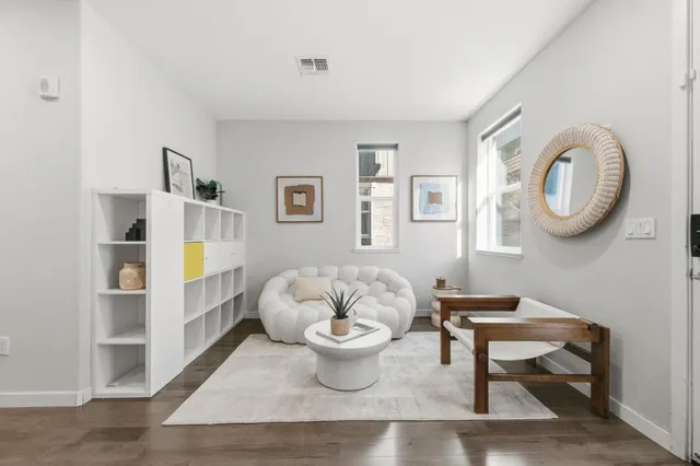 a living room with furniture and a table