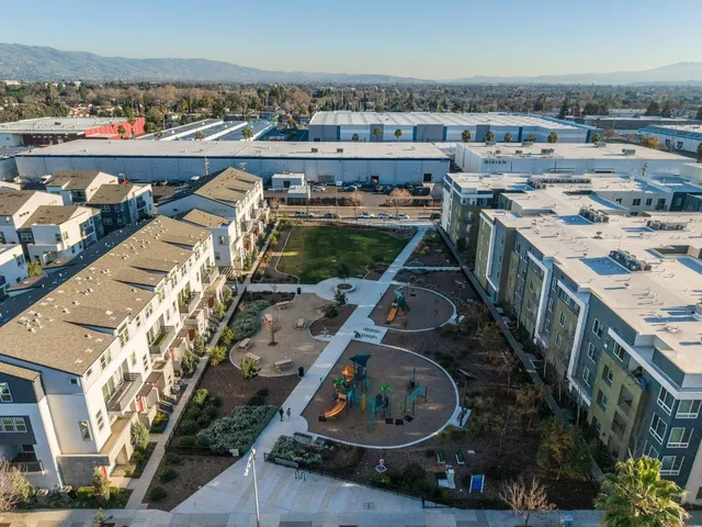an aerial view of a house with outdoor space