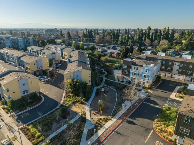 an aerial view of a house with lots of residential buildings