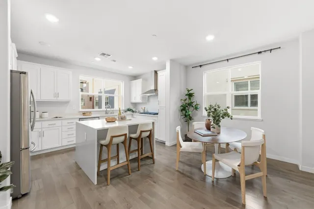 a kitchen with a table and chairs in it