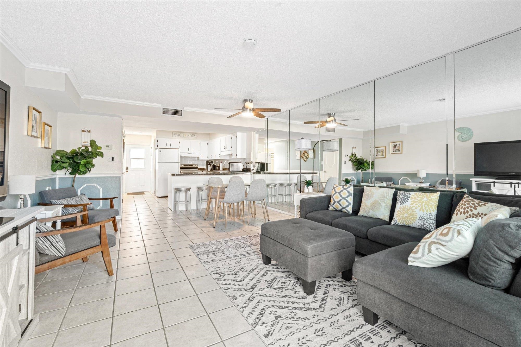 1 Ocean Trace Road, Unit 242 St. Augustine, FL 32080 - Photo 11 of 66 a living room with lots of furniture and kitchen view
