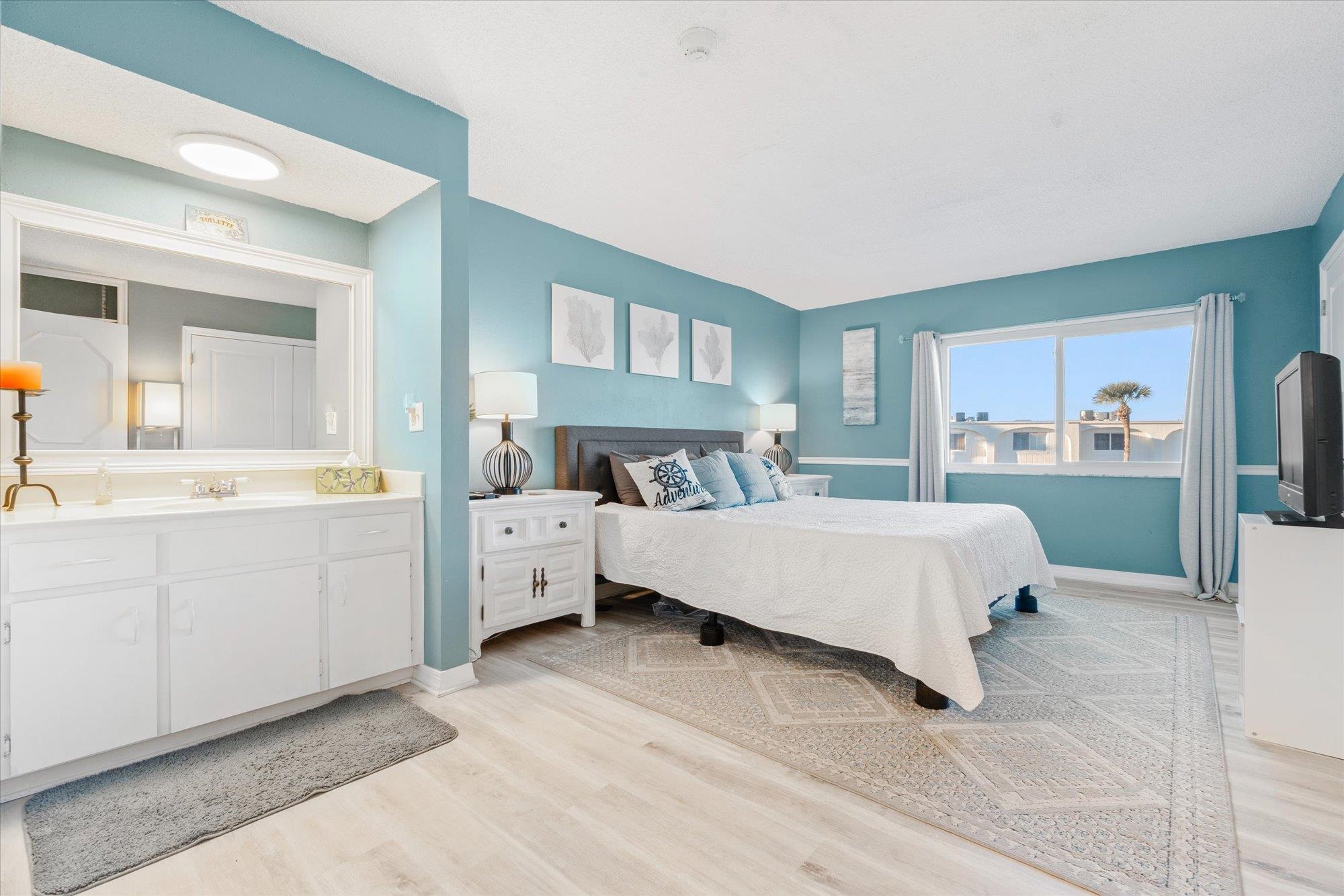 1 Ocean Trace Road, Unit 242 St. Augustine, FL 32080 - Photo 13 of 66 a bedroom with a large bed and a dresser