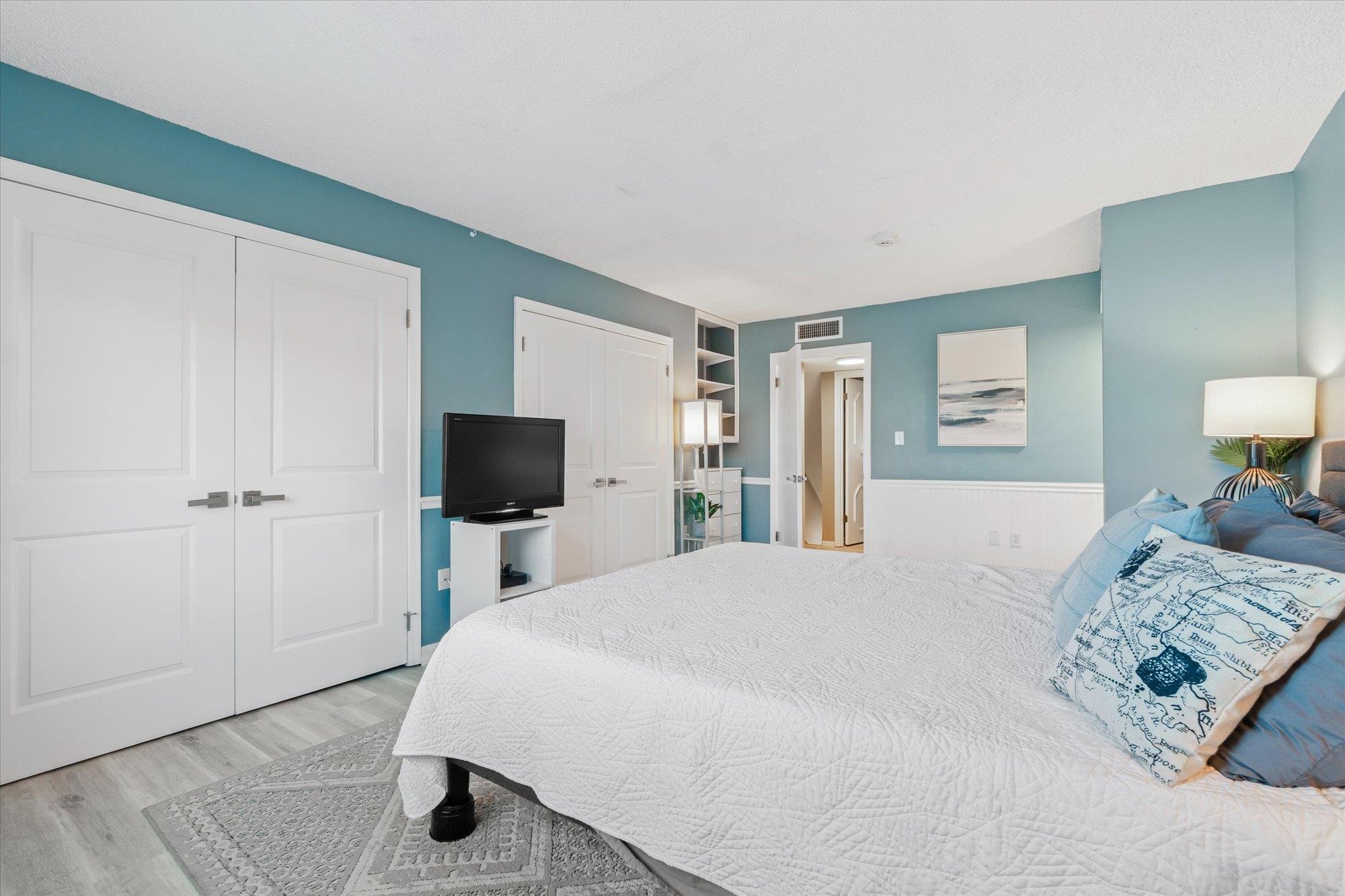 1 Ocean Trace Road, Unit 242 St. Augustine, FL 32080 - Photo 16 of 66 a bedroom with a bed and a flat screen tv