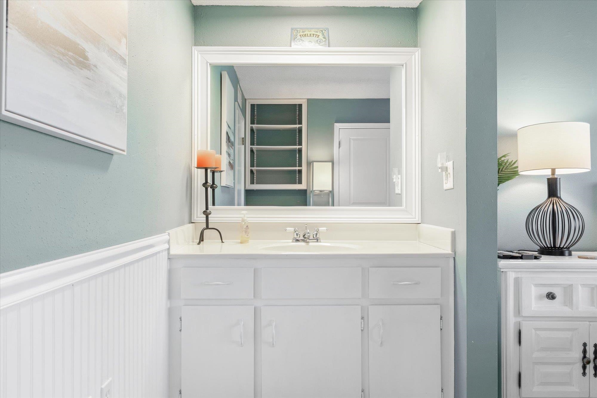 1 Ocean Trace Road, Unit 242 St. Augustine, FL 32080 - Photo 17 of 66 a bathroom with a sink and a mirror