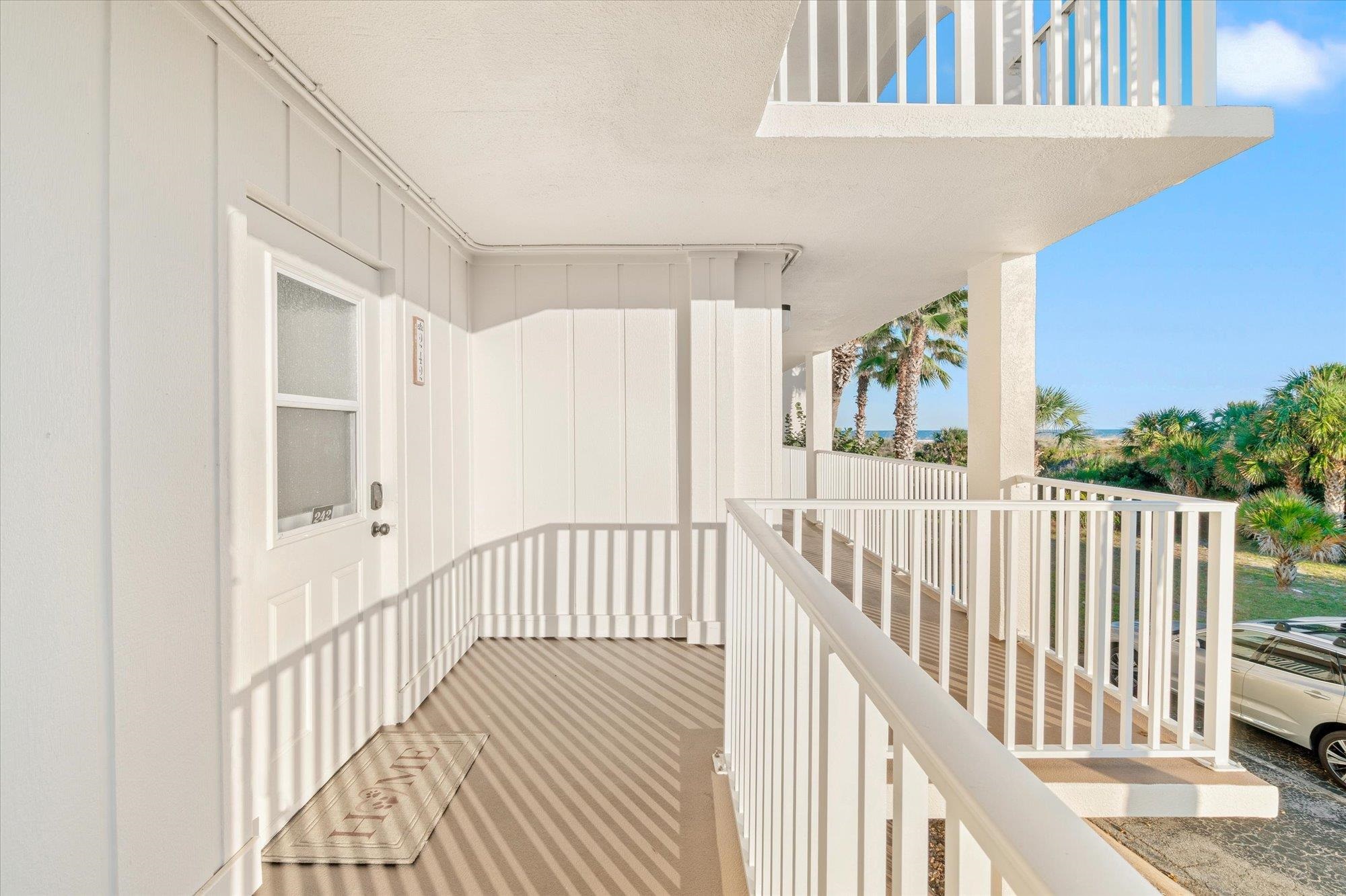 1 Ocean Trace Road, Unit 242 St. Augustine, FL 32080 - Photo 29 of 66 a view of a hallway with wooden floor and windows