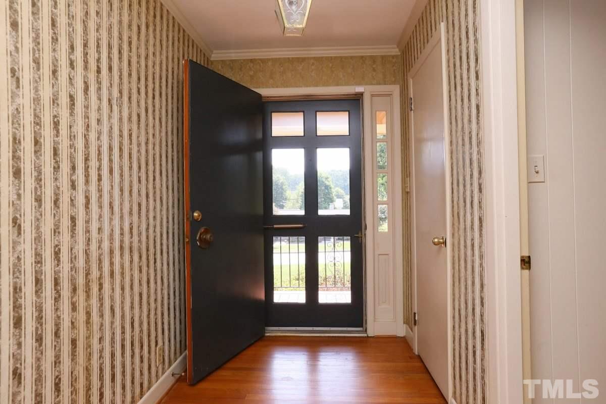 1913 Highland Place Raleigh, NC 27607 - Photo 3 of 25 a view of entryway with wooden floor
