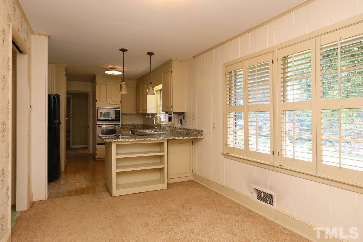 1913 Highland Place Raleigh, NC 27607 - Photo 5 of 25 a view of kitchen and kitchen with a large window