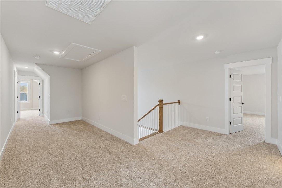 319 Summerall Drive Anderson, SC 29621 - Photo 25 of 37 This carpeted loft space features recessed lighting and offers a versatile area for various uses.