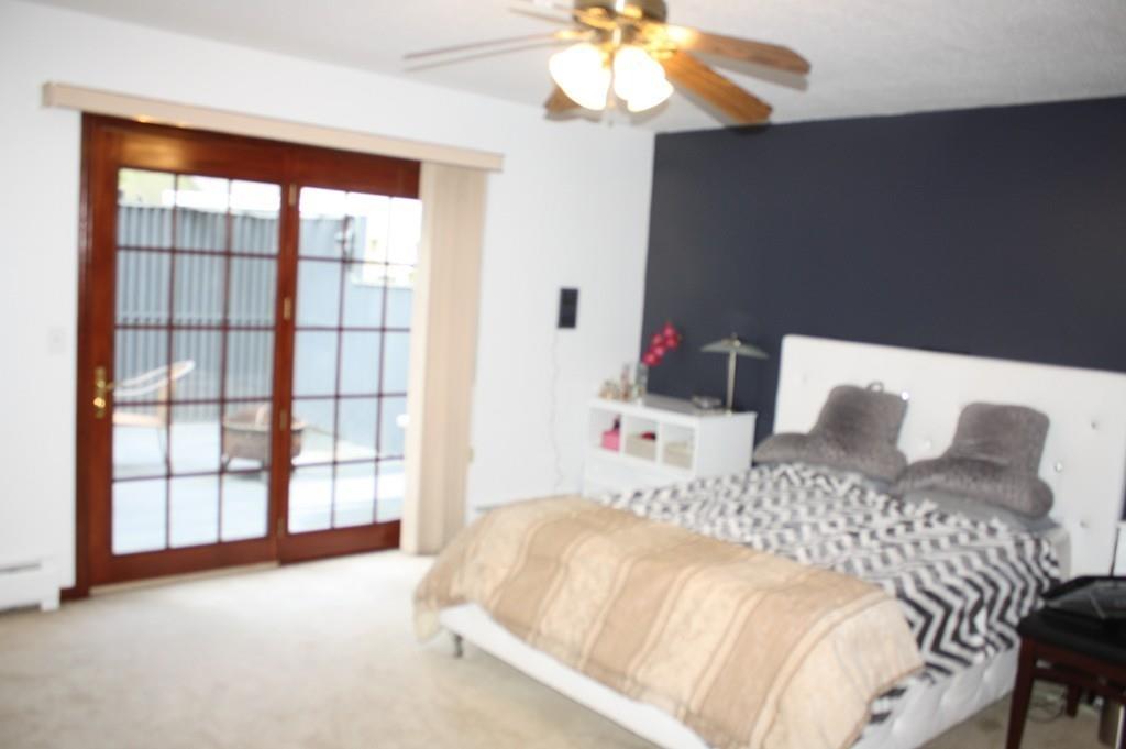 82 Stillwater Road Deerfield, MA 01373 - Photo 16 of 22 a bedroom with a bed and a large window