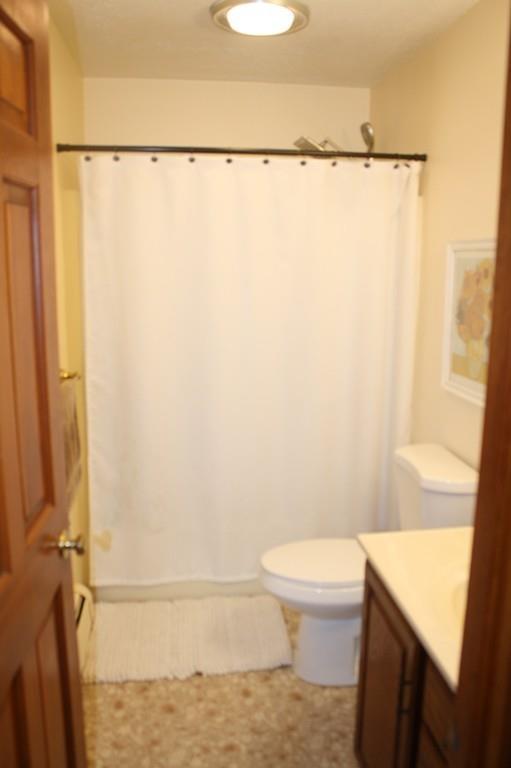 82 Stillwater Road Deerfield, MA 01373 - Photo 19 of 22 a bathroom with a toilet and a shower curtain