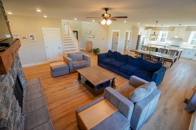 a bed room with a bed and a ceiling fan