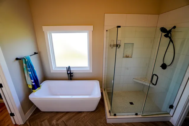 a bathroom with a double vanity sink and mirror