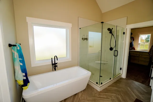 a view of walk in closet with clothes