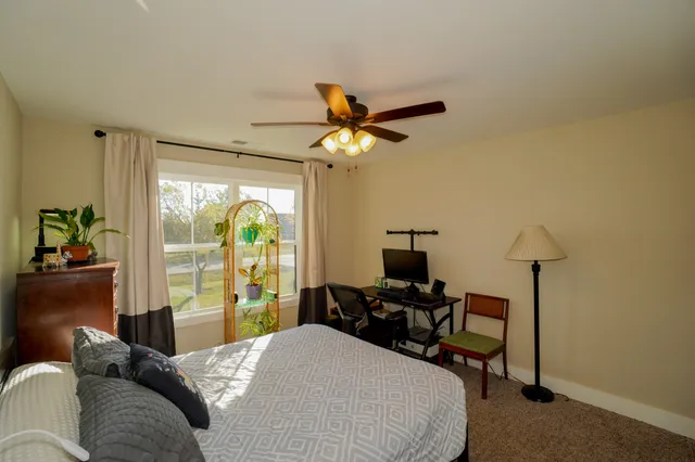 a bathroom with a double vanity sink toilet and a mirror