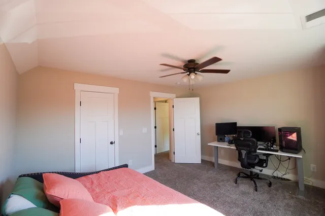 a view of a livingroom with furniture and toys
