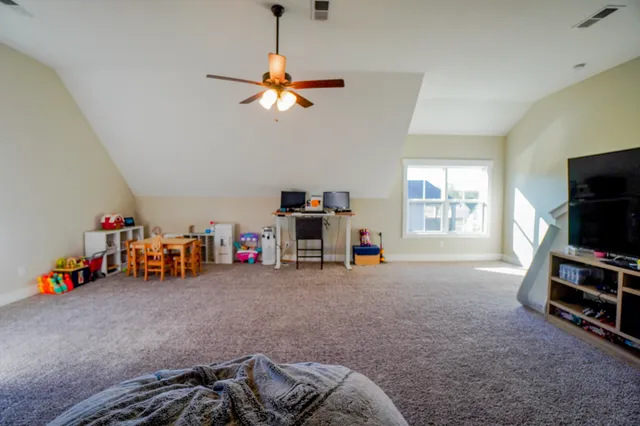 a bedroom with furniture and a bed