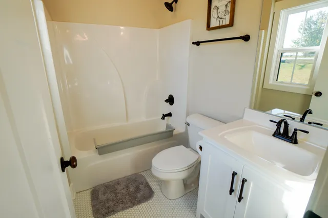 a bathroom with a sink and cabinets
