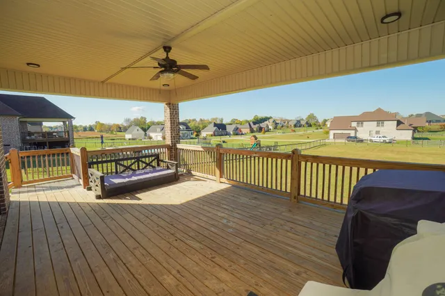 a room with wooden floor and balcony