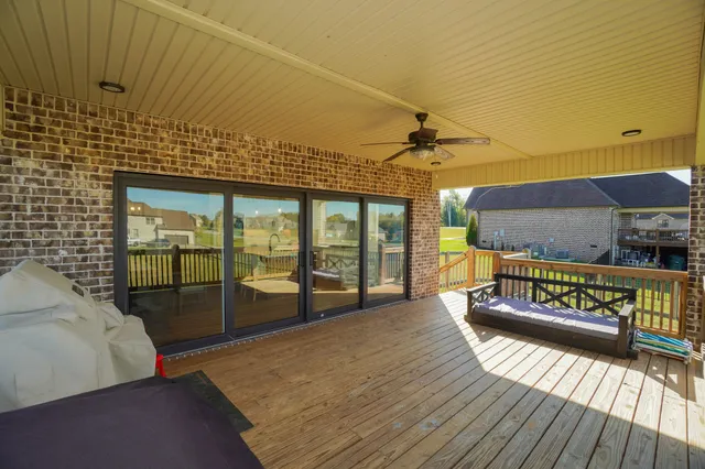 a view of a balcony with furniture