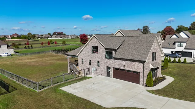 an aerial view of a house having yard