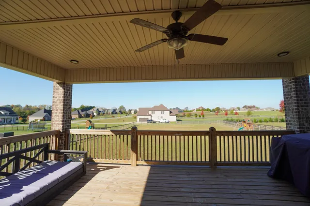 a aerial view of a house with a garden and deck
