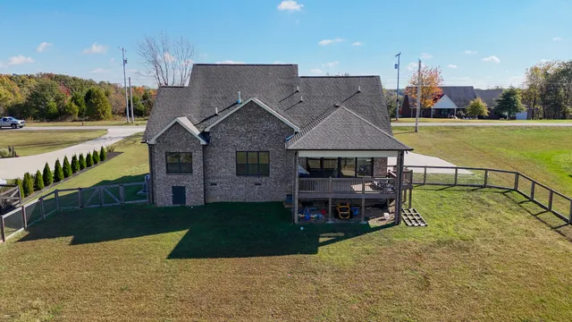 a view of a swimming pool with a yard