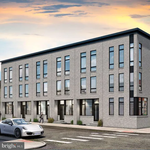 a couple of cars parked in front of a building