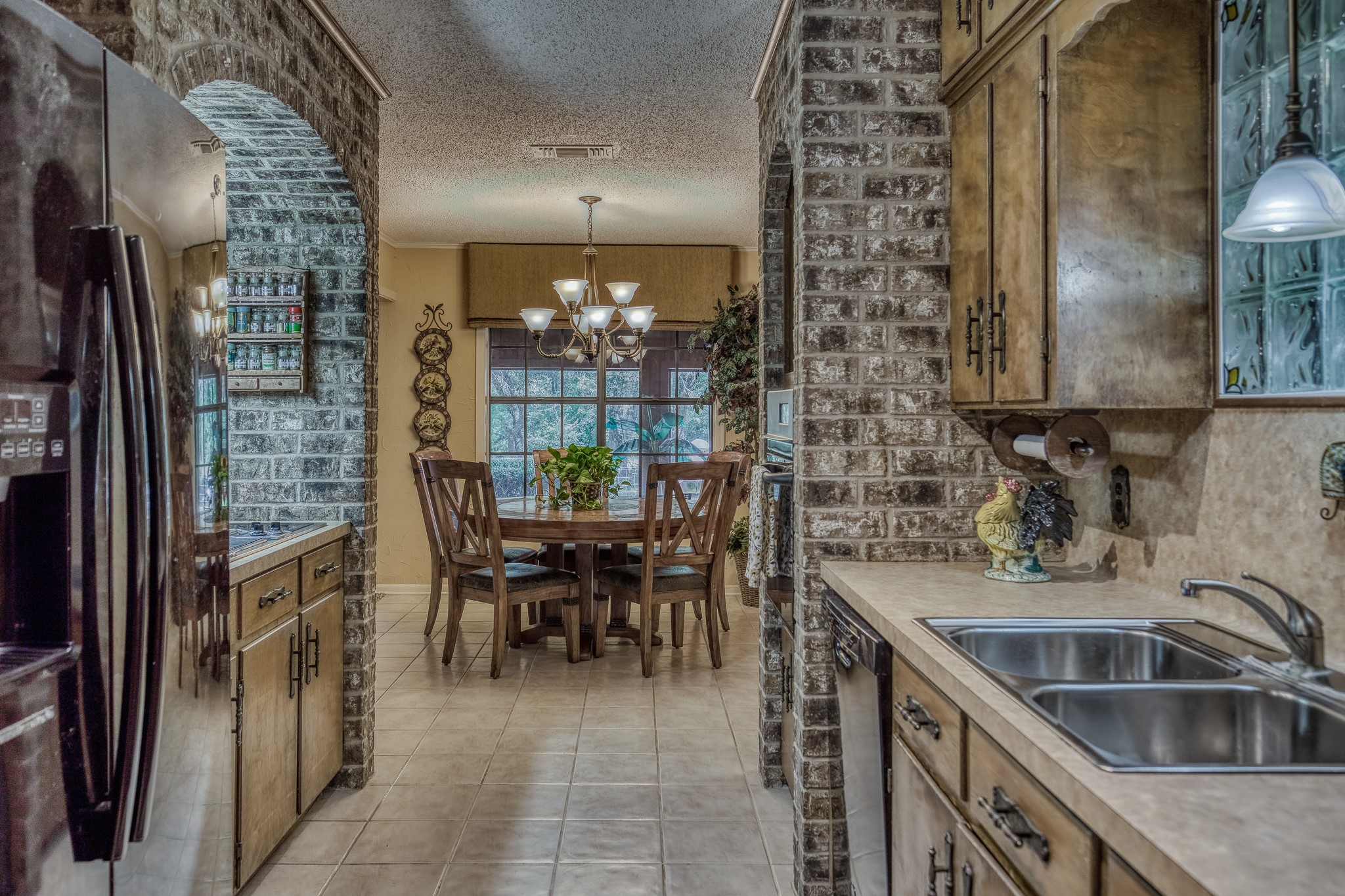10639 Palestine Road Brenham, TX 77833 - Photo 13 of 42 a kitchen with a sink and a refrigerator