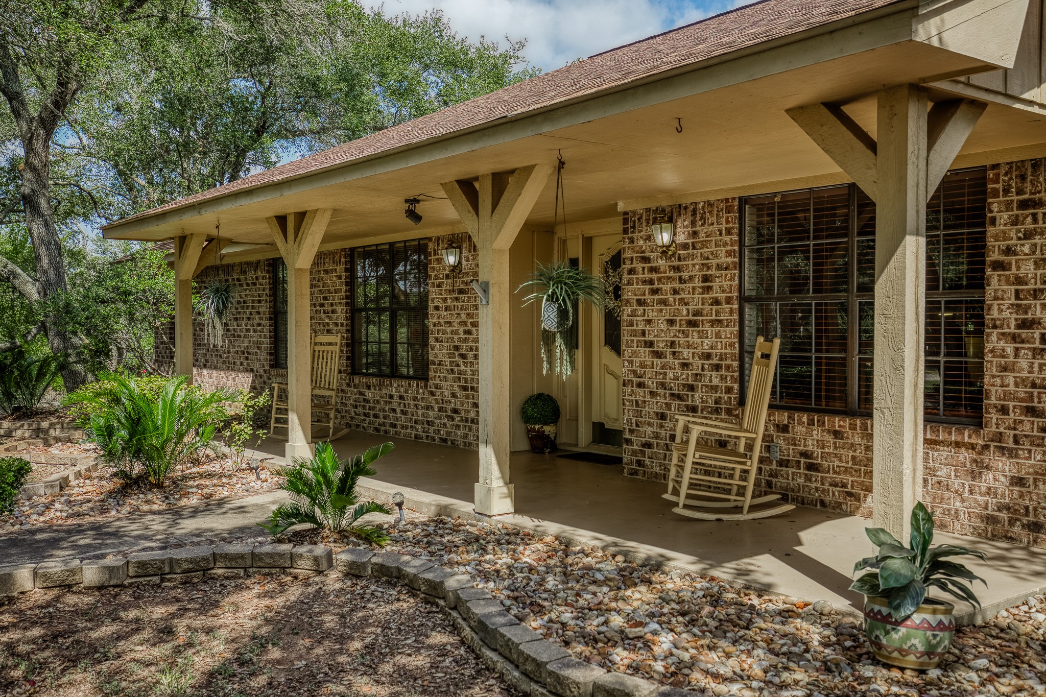 10639 Palestine Road Brenham, TX 77833 - Photo 2 of 42 a front view of a house with garden