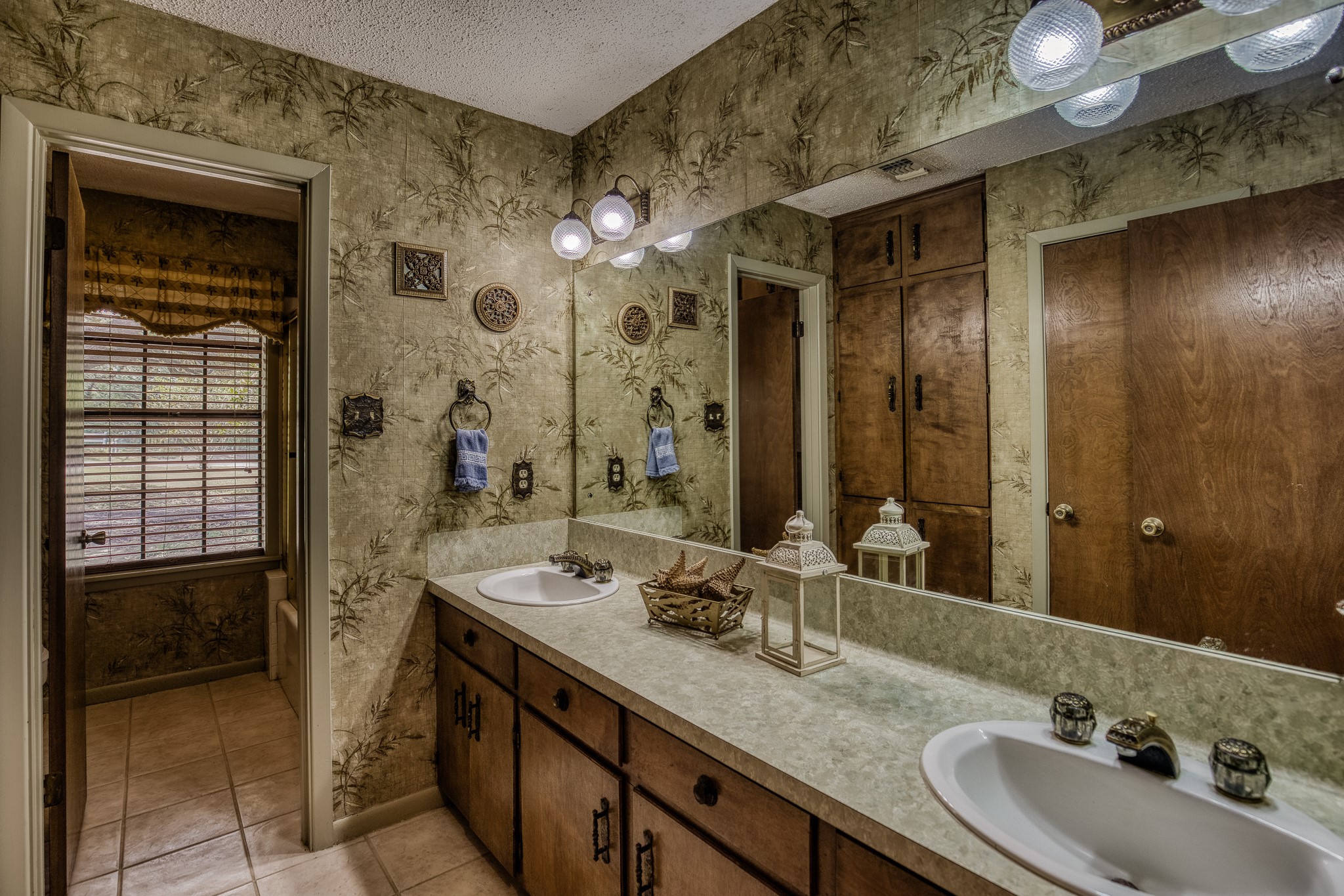 10639 Palestine Road Brenham, TX 77833 - Photo 24 of 42 a bathroom with a double vanity sink a mirror and a shower