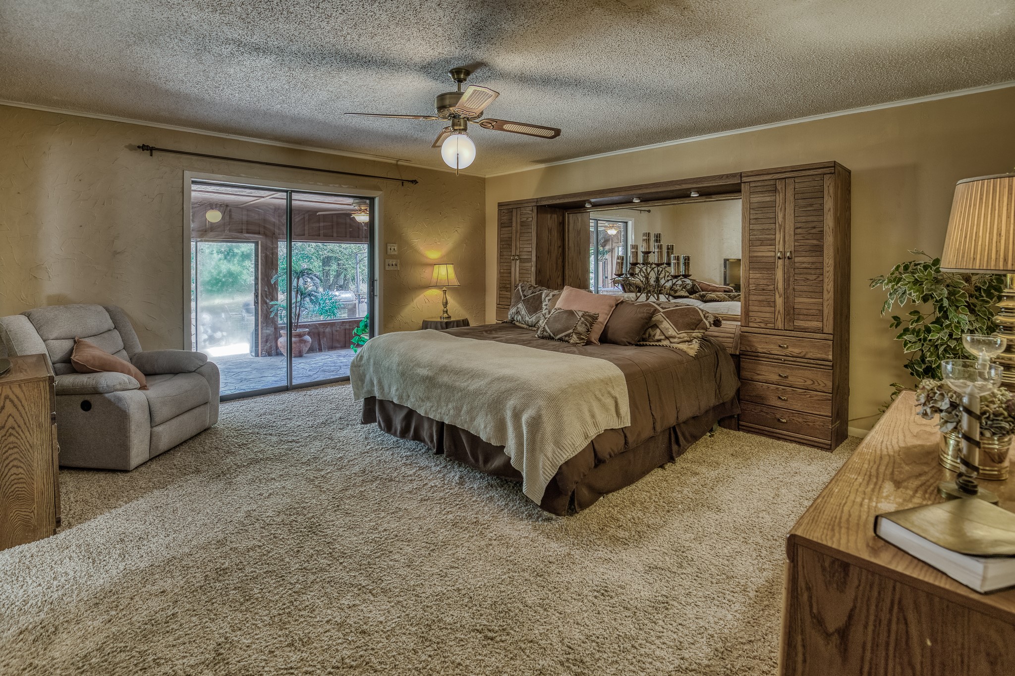 10639 Palestine Road Brenham, TX 77833 - Photo 26 of 42 a spacious bedroom with a bed and large windows