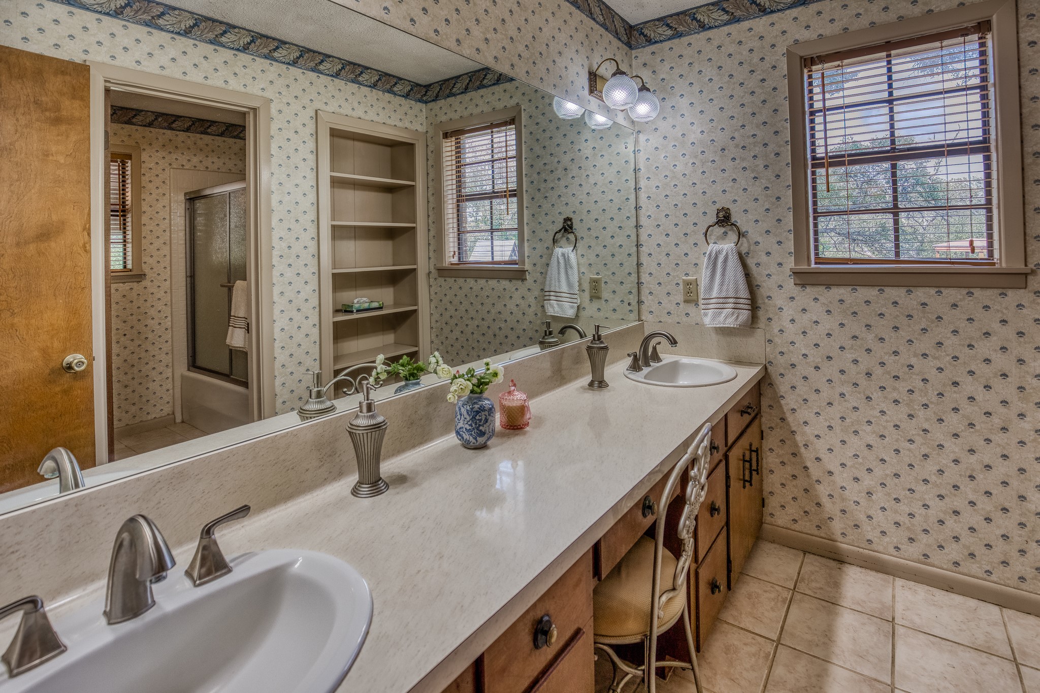 10639 Palestine Road Brenham, TX 77833 - Photo 28 of 42 a bathroom with a double vanity sink a mirror and a bathtub