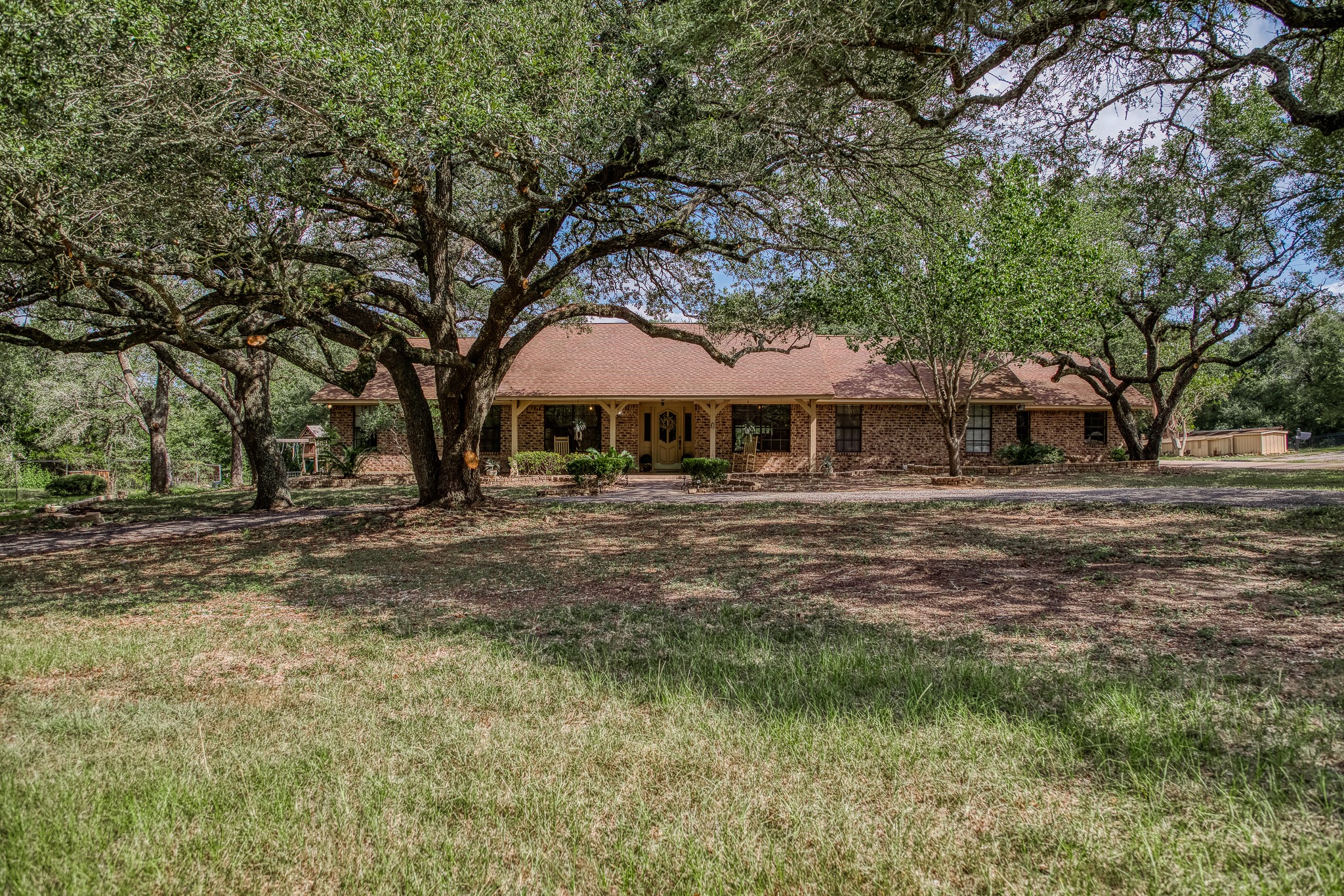 10639 Palestine Road Brenham, TX 77833 - Photo 3 of 42 a front view of a house with garden