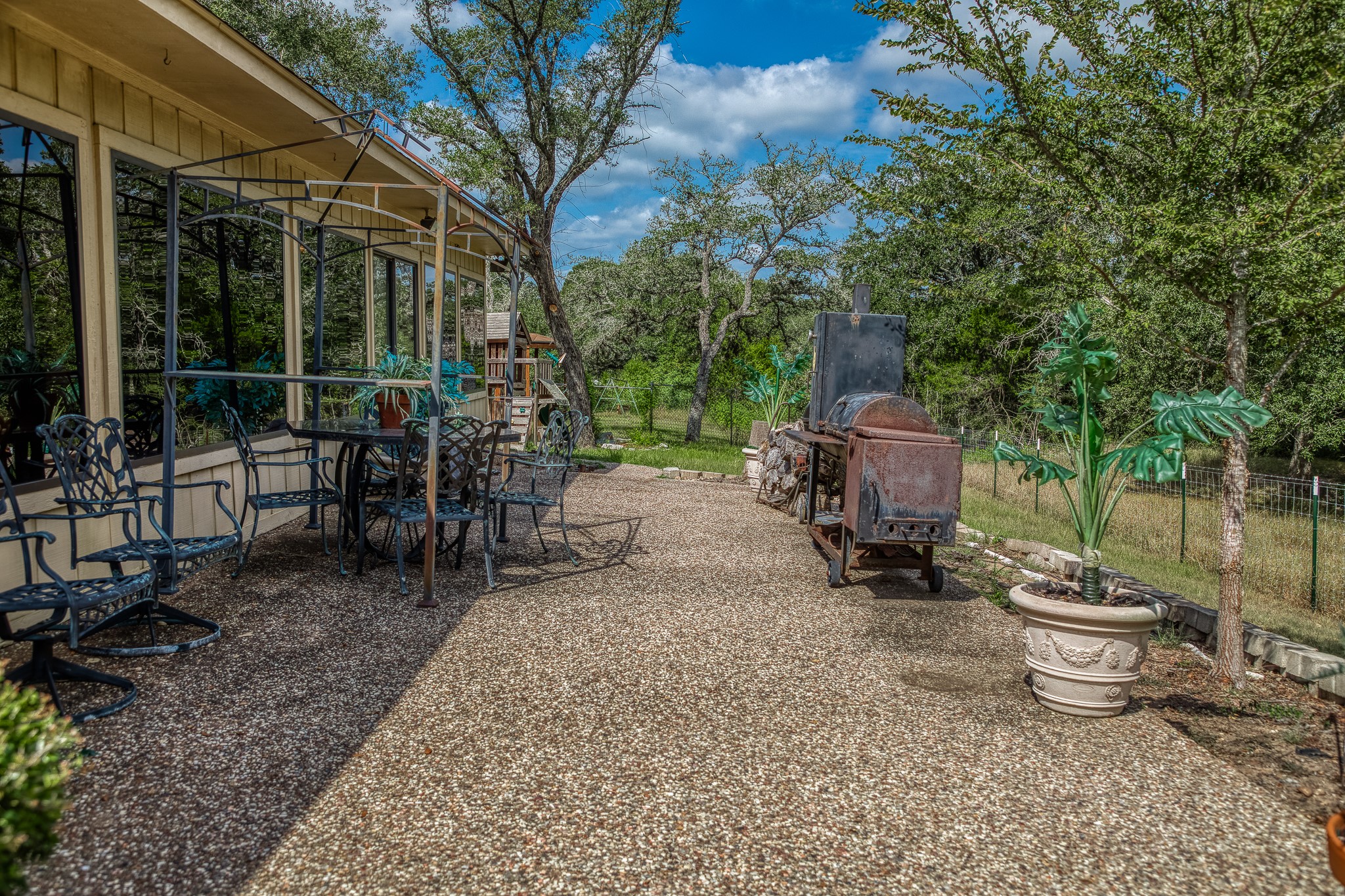10639 Palestine Road Brenham, TX 77833 - Photo 36 of 42 a backyard of a house with table and chairs