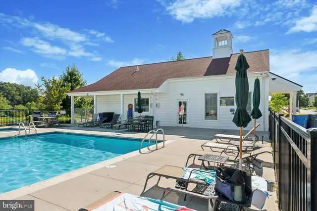 a view of a patio with couches chairs and potted plants