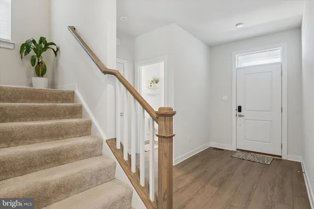 a view of staircase with white walls
