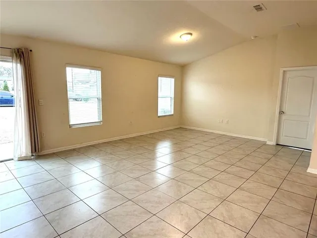 a view of an empty room and window