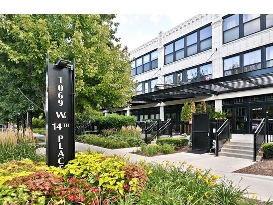 a front view of a building with street view