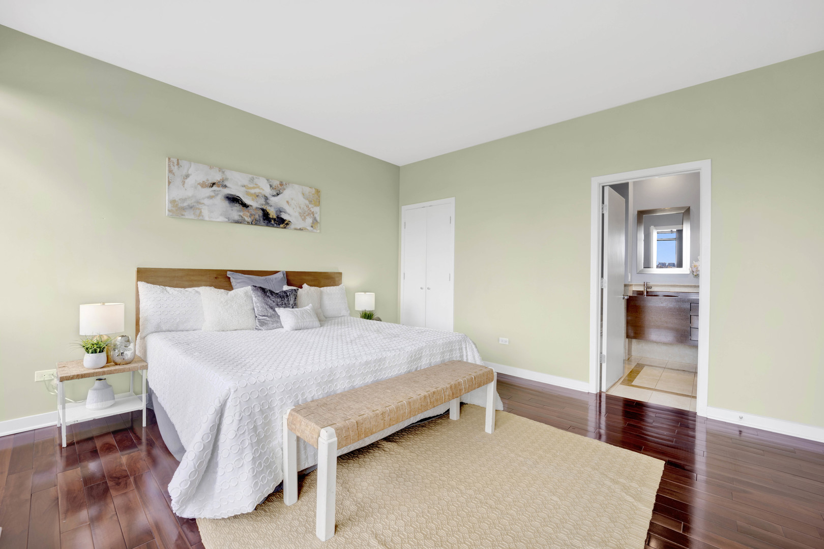 1069 West 14th Place, Unit 323 Chicago, IL 60608 - Photo 15 of 43 a bedroom with a bed and wooden floor