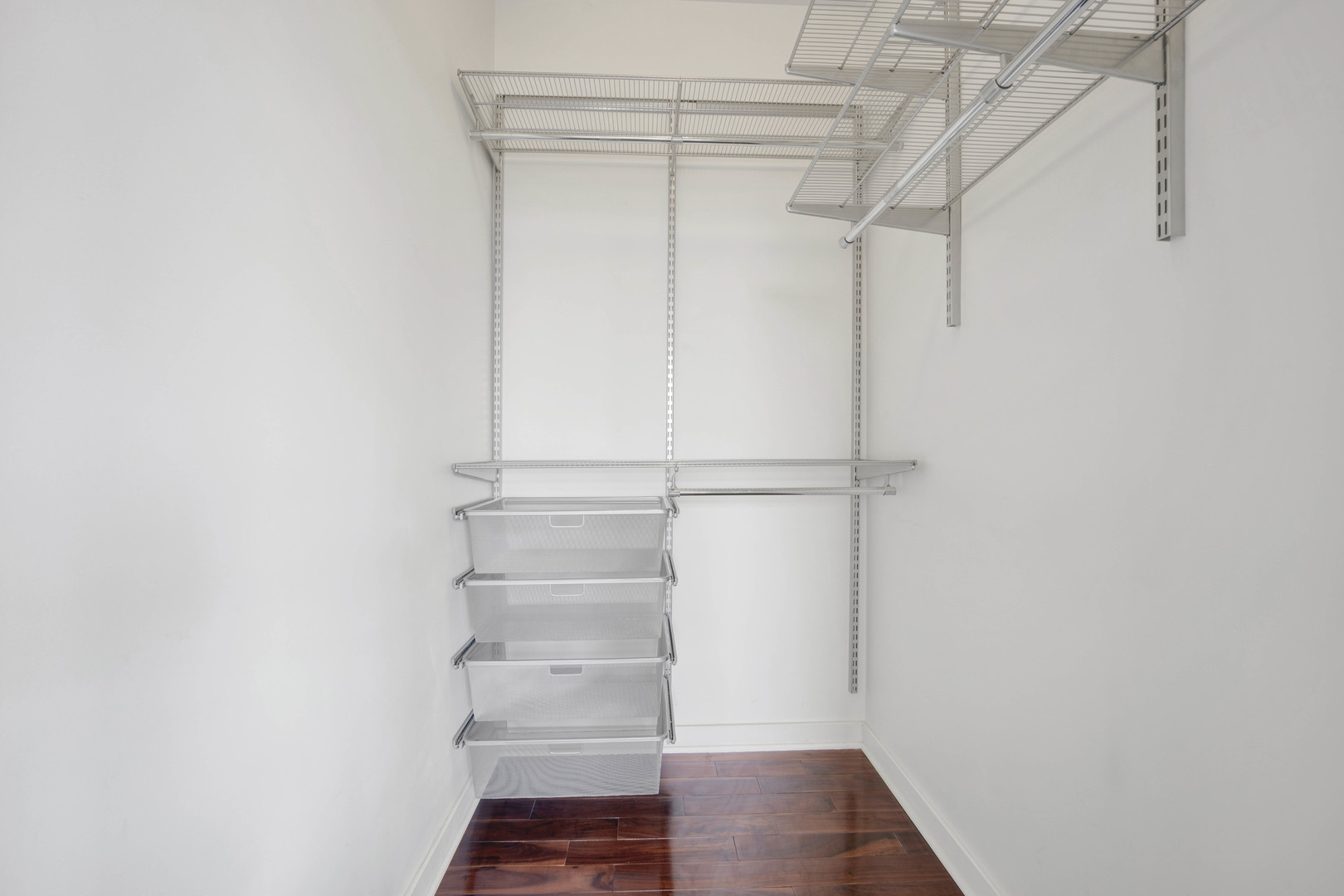 1069 West 14th Place, Unit 323 Chicago, IL 60608 - Photo 17 of 43 a view of walk in closet with empty racks