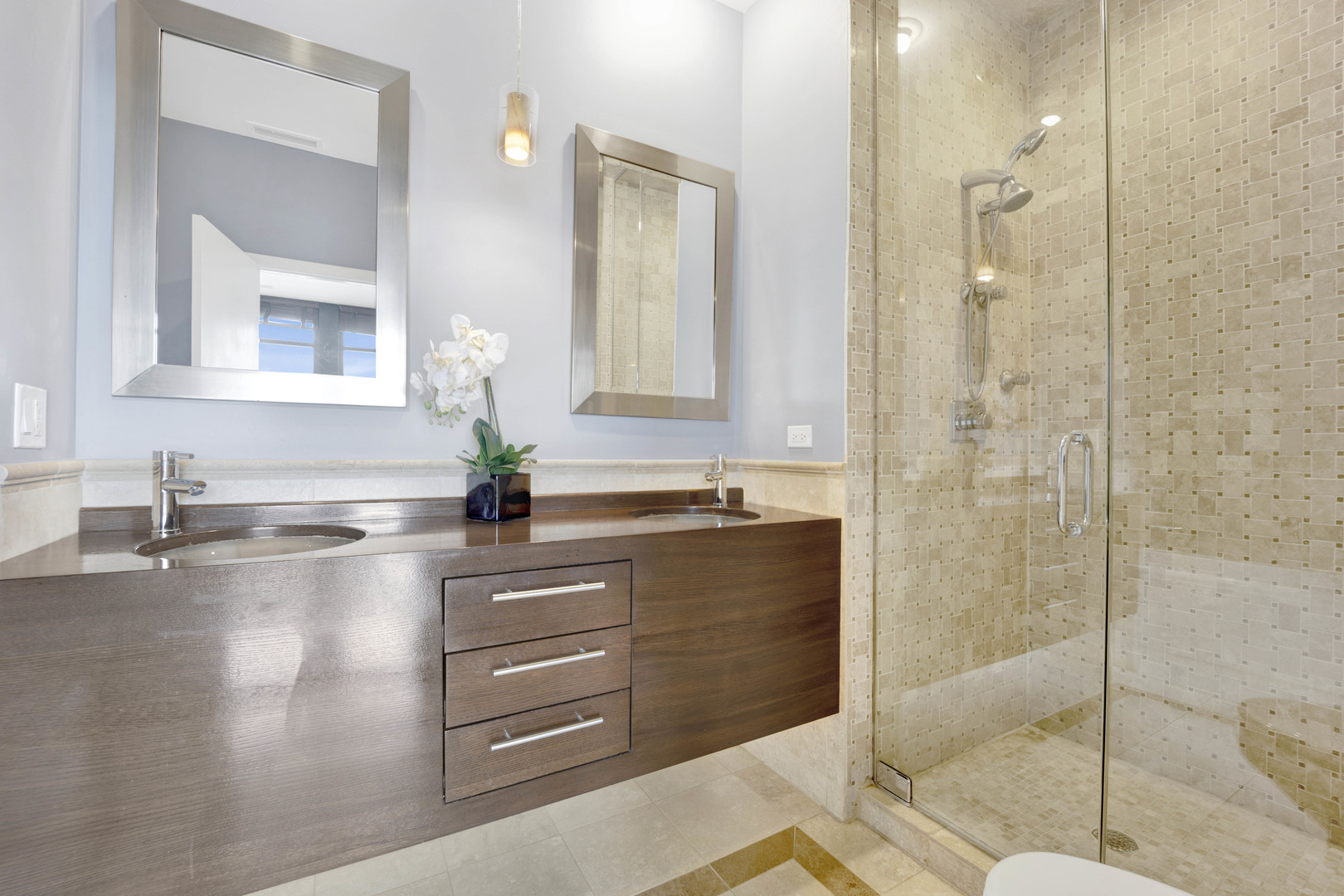 1069 West 14th Place, Unit 323 Chicago, IL 60608 - Photo 18 of 43 a bathroom with a sink and a mirror