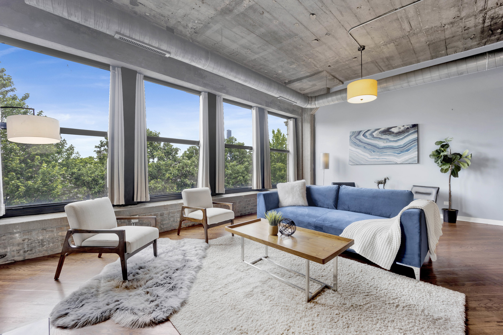 1069 West 14th Place, Unit 323 Chicago, IL 60608 - Photo 2 of 43 a living room with furniture and a large window