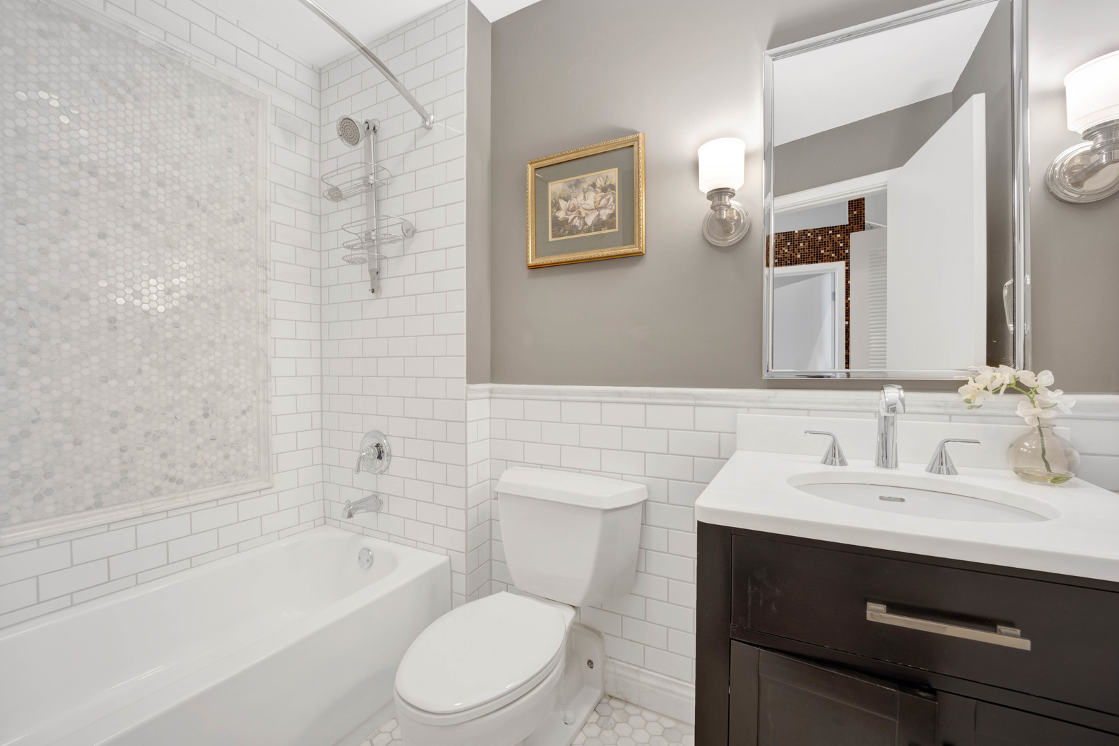 1069 West 14th Place, Unit 323 Chicago, IL 60608 - Photo 24 of 43 a bathroom with a sink a toilet and shower