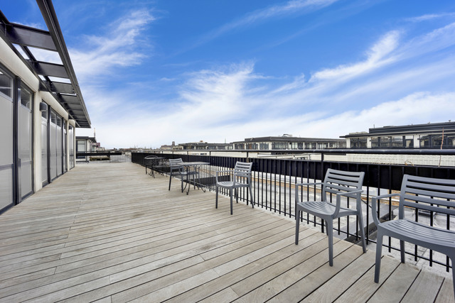 1069 West 14th Place, Unit 323 Chicago, IL 60608 - Photo 35 of 43 a terrace with outdoor seating