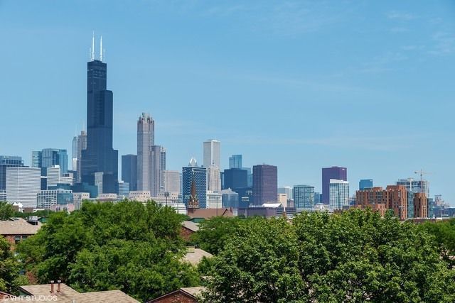 1069 West 14th Place, Unit 323 Chicago, IL 60608 - Photo 37 of 43 a view of a city with tall buildings