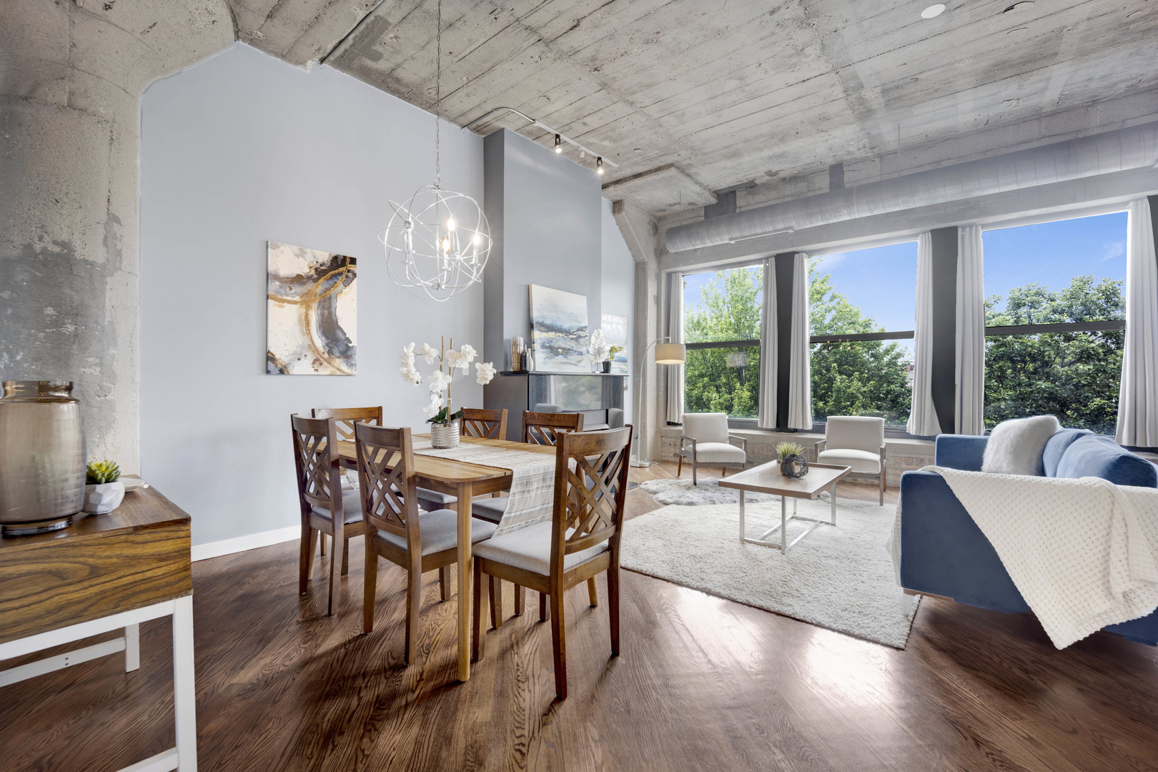 1069 West 14th Place, Unit 323 Chicago, IL 60608 - Photo 4 of 43 a view of a dining room with furniture window and wooden floor