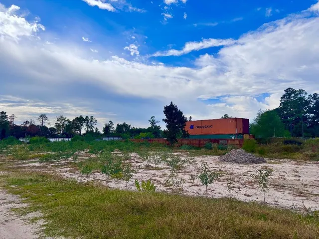 a view of a lake with a big yard