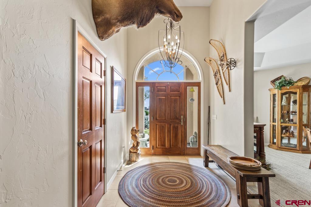 15103 6260th Road Montrose, CO 81403 - Photo 10 of 45 a view of hall way with furniture and front door