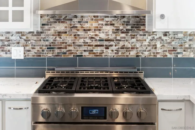 a kitchen with counter top space appliances and cabinets