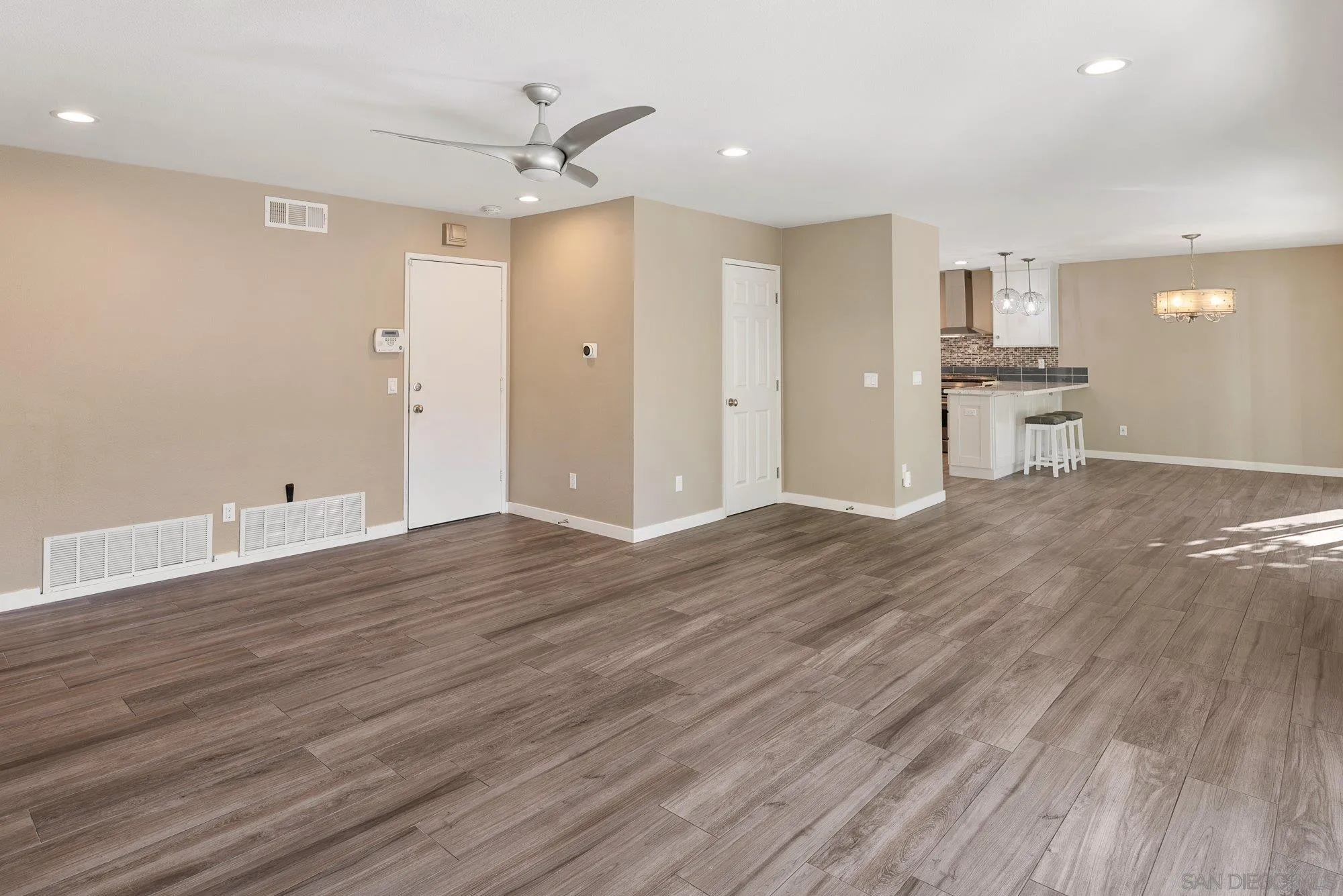 14274 Woodcreek Road Poway, CA 92064 - Photo 19 of 57 a view of kitchen with wooden floor and window